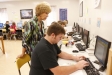 Suzanne McCowan helps Dustin Lewis with his English IV assignment at the McDaniel Learning Center (Laurel County). The students can work at their own pace through the program.
Photo by Amy Wallot, Sept. 7, 2012