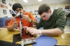 Sophomores Sibi Rajendran, left, and Zack Banta create a model simulation of a bacteria heater and cooler during Mark Harrell\'s Principles of Engineering class at the Franklin County Career and Technical Center Dec. 1, 2010. Photo by Amy Wallot