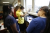 Freshman Mariah Lanoire, Hannah Moore and Emily Flener analyze DNA during Jon Ezzell's Principles of Biomedical Science class at Muhlenburg County High School May 20, 2010.
Photo by Amy Wallot