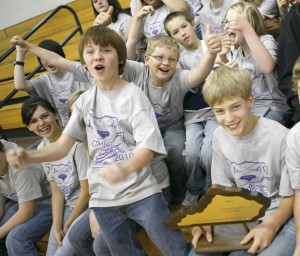 Students celebrate with the Schools to Watch trophy at Chandler's Elementary School's (Logan County) Schools to Watch celebration April 14, 2010. The school's teachers use "I can" statements and learning targets to inform students of what they are learning. Photo by Amy Wallot