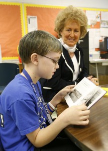 Fifth-grade student Jacob Williams reads with "Granny" Lorene Whitaker at Carr Creek Elementary School (Knott County) Feb. 17, 2011. Whitaker is part of the Foster Granny Program, where senior citizens volunteer to tutor children. Photo by Amy Wallot