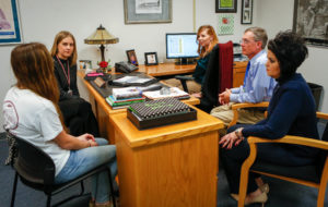 A Harrison County High School student meets with Counselor Allison Earlywine, Assistant Principal Jenny Nichols, Director of Pupil Personnel Bow Switzer and Chief Academic Officer Jenny Lynn Hatter, left to right. Students who are considering leaving school meet with committees tailored to them as part of the district's effort to help students persist to graduation. Photo by Mike Marsee, Dec. 13, 2016