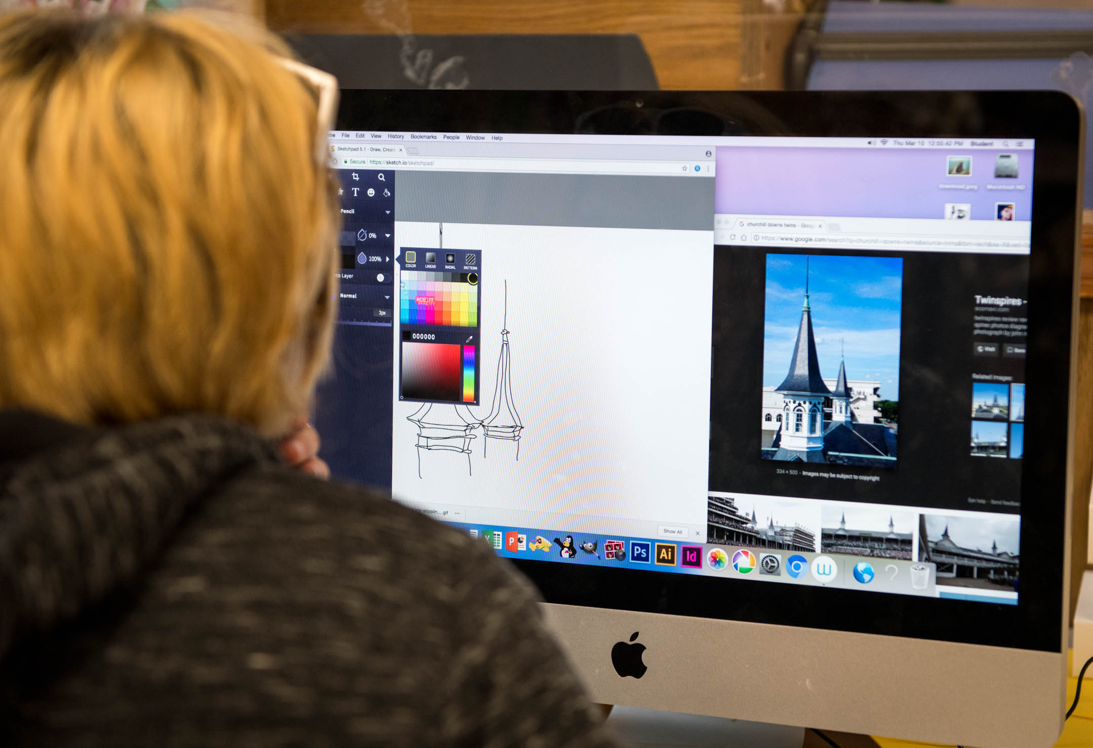 Ben Shirley uses a computer program to draw the twin spires at Churchill Downs for the Easter Egg design. Photo by Bobby Ellis, March 15, 2018