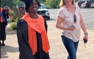 Photo of DeMichael Hall and woman walking