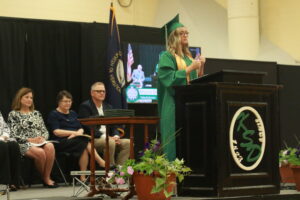 Student speaking at the podium at the graduation