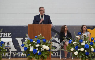 Todd Moody speaks behind a podium