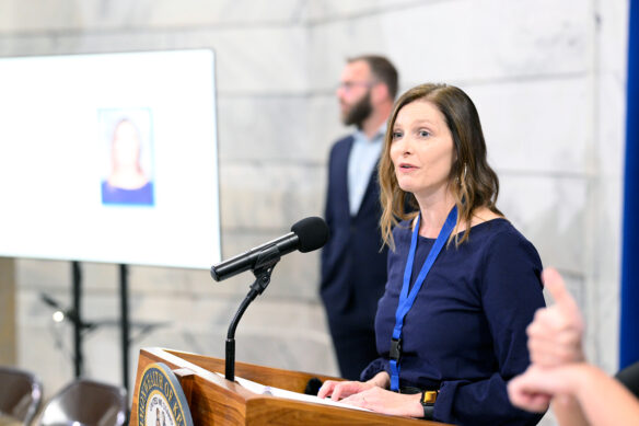 Jennifer Montgomery speaks at a podium