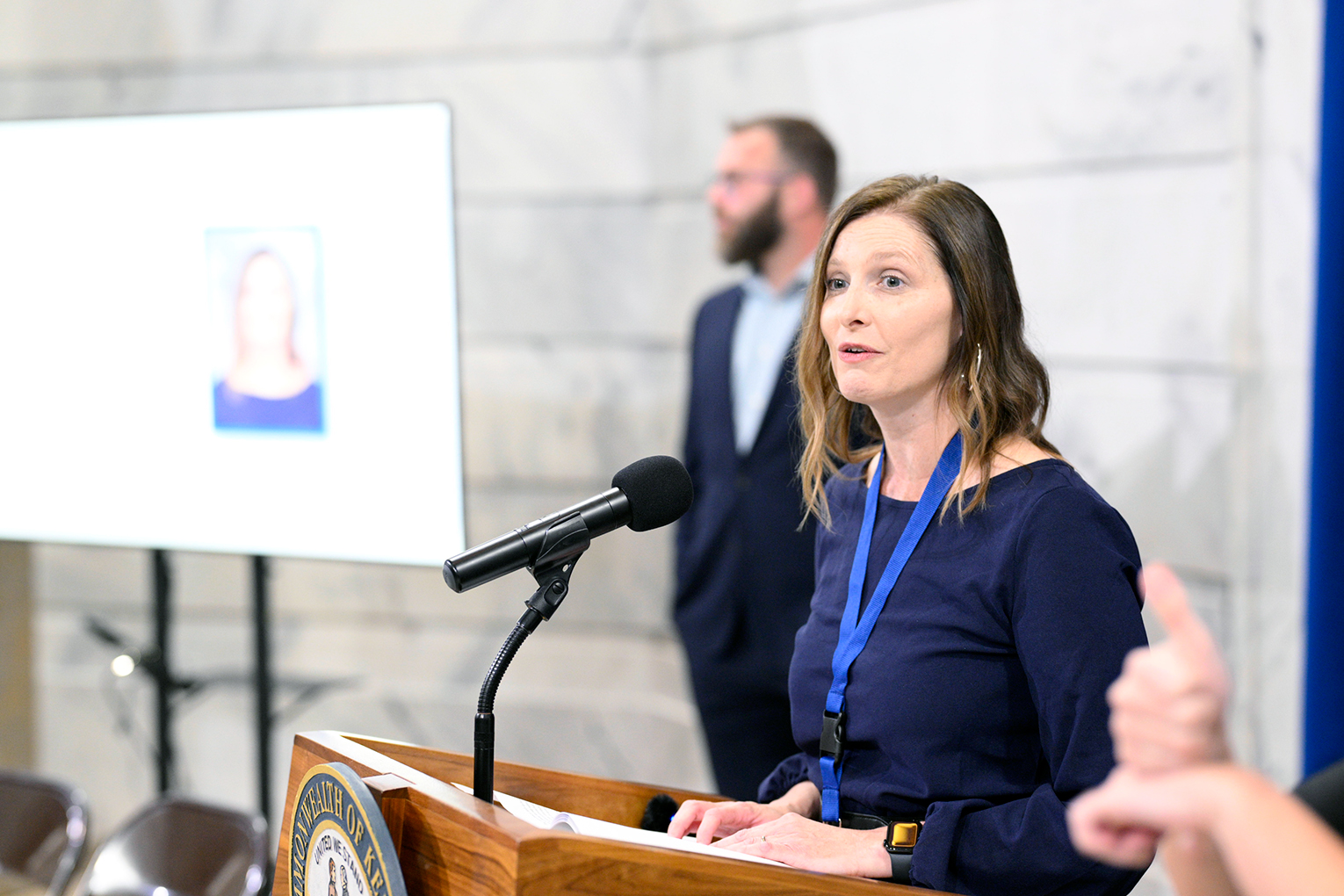 Jennifer Montgomery speaks at a podium